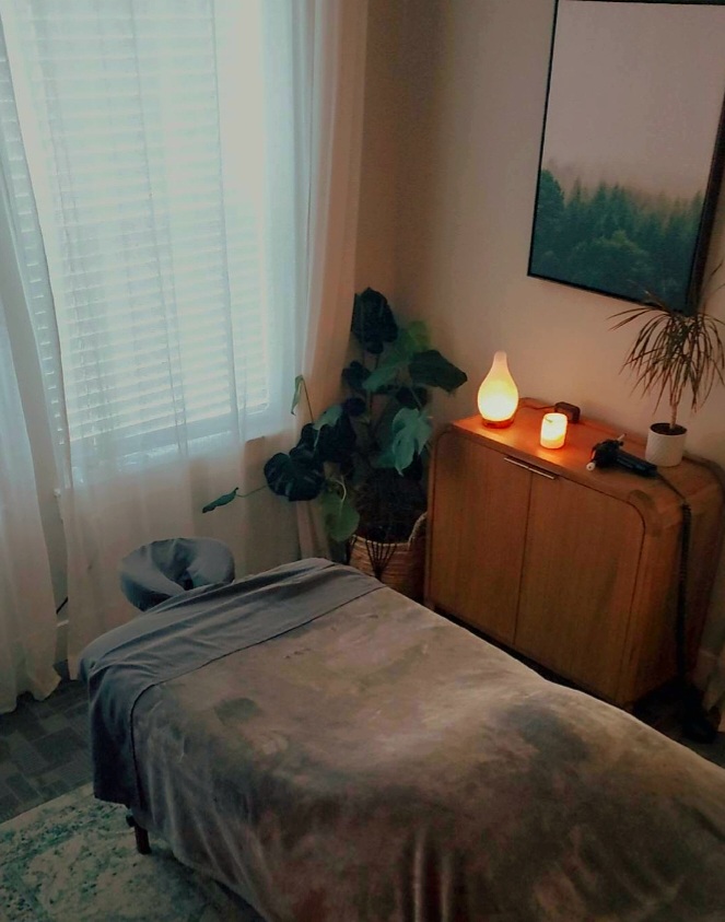 The Quiet Light treatment room with warm lamplight and soft daylight